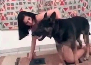 She is falling in wild love with a doggy