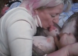 Sexy older lady puts dog cock in her mouth