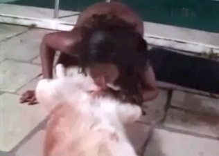 Ebony zoophile is banging with a dog